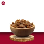 close-shot-of-a-tasty-sweet-chewy-golden-brownish-munakka-in-a-wooden-bowl