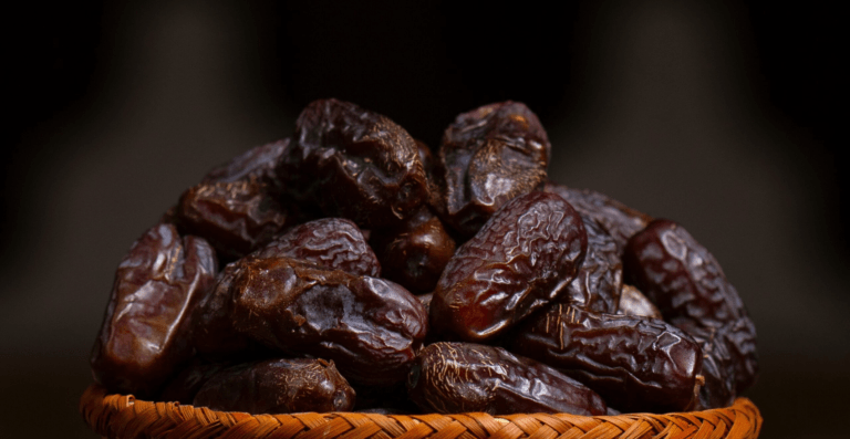 close-up-macro-shot-of-ajwa-dates-in-abrown-color-wooden-bowl-high-resolution