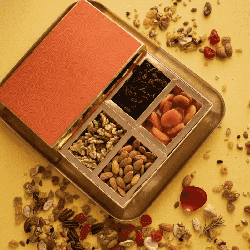 Sufyan Golden Metallic Tray Gift Box with terracotta wave patterned lid featuring black raisins, dried apricots, walnut kernels, and whole almonds