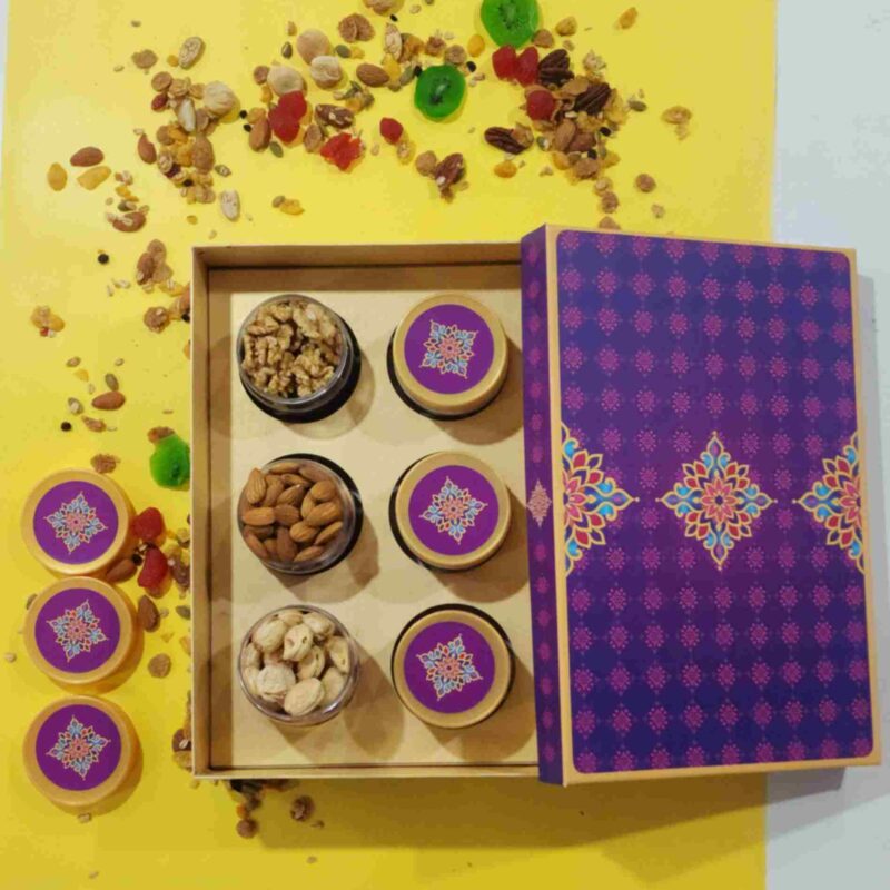 Sufyan Royal Purple Mandala 6-Jar Dry Fruit Gift Box showing open clear jars filled with walnuts, almonds, and cashews beside decorative mandala pattern lids